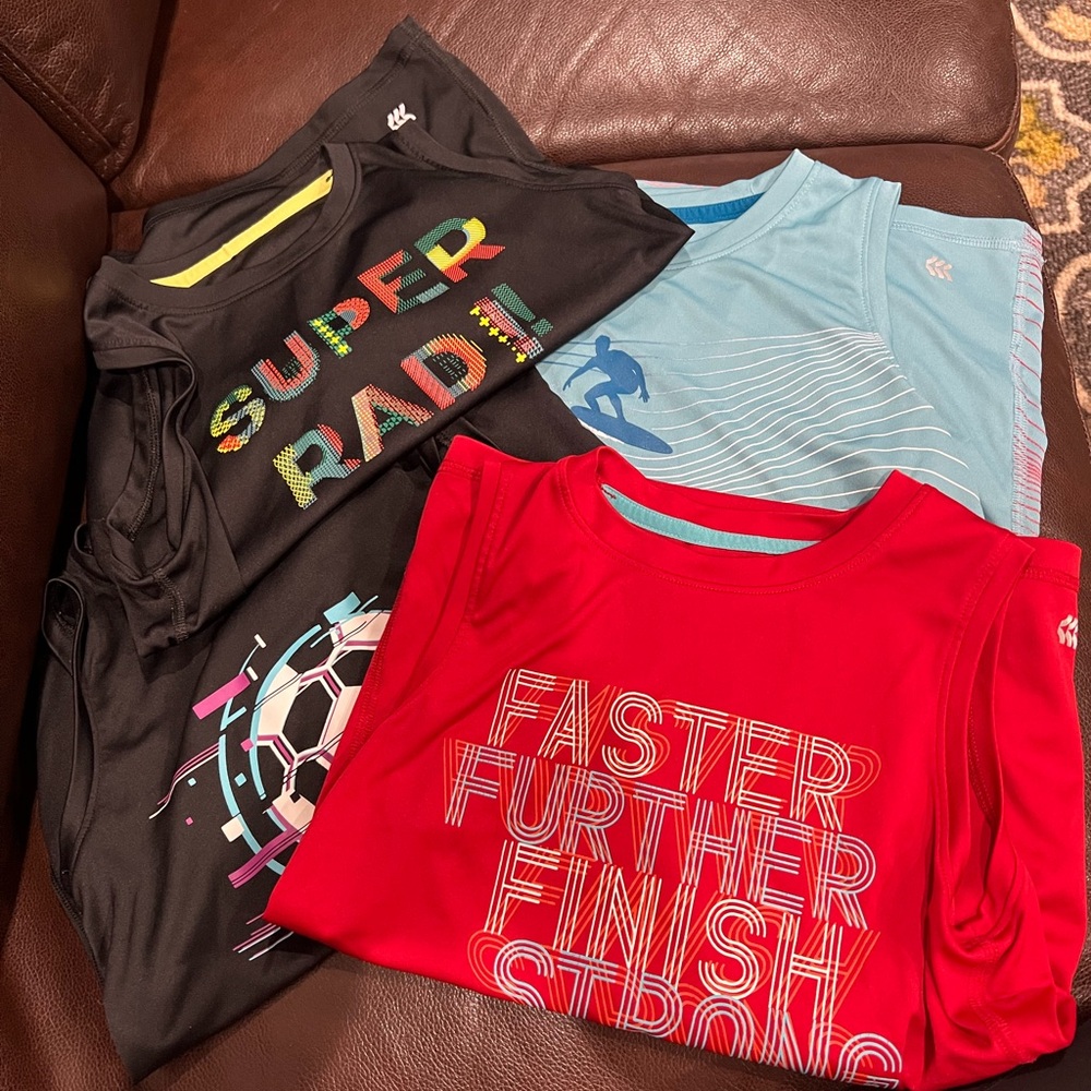 Set of 4 sleeveless All in Motion boys shirts. Excellent condition! Size 6/7